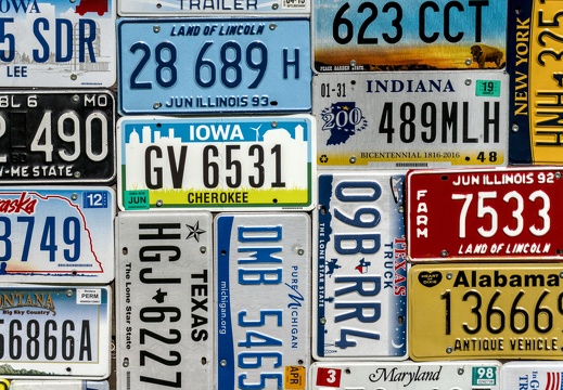 A montage wall of American number plates