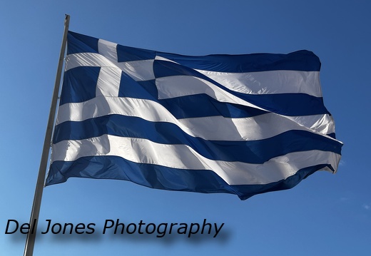 The Greek flag blowing proudly in the wind 