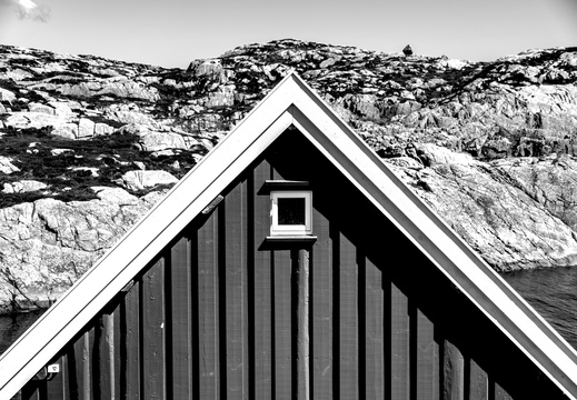 A pointy black and white roof