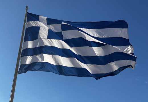 The Greek flag blowing proudly in the wind 