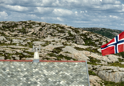 A roof with a flag
