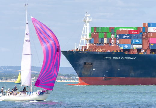 CMA - CGM next to a yacht
