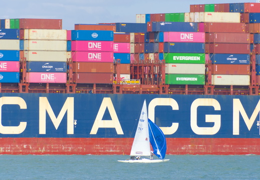 CMA - CGM next to a yacht